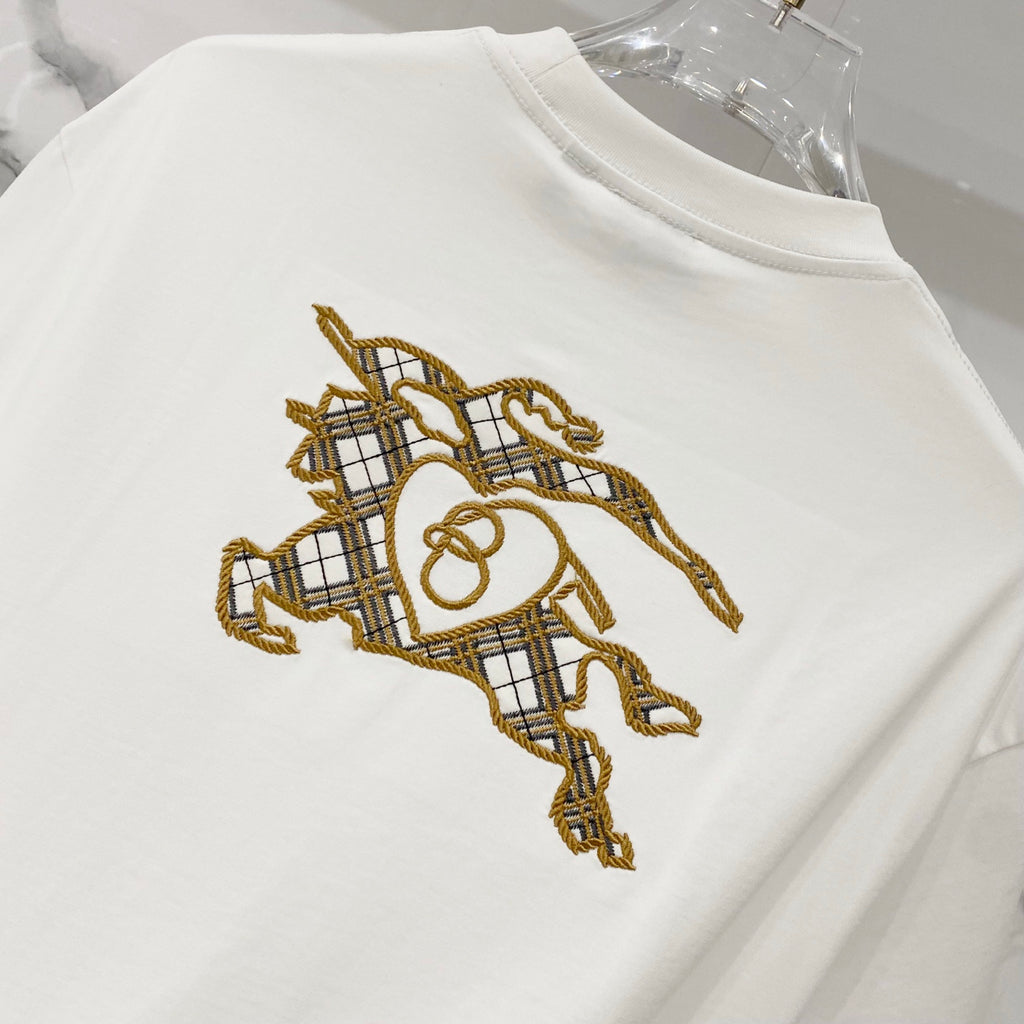 White short-sleeve T-shirt with embroidered gold horse rider graphic