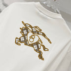 White short-sleeve T-shirt with embroidered gold horse rider graphic