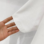 White short-sleeve T-shirt fabric sleeve and hem close-up