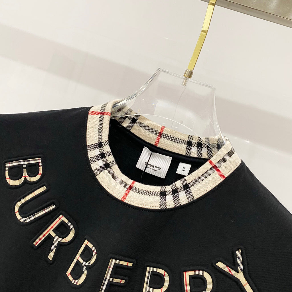 Burberry black T-shirt neckline with checkered collar trim and BURBERRY lettering