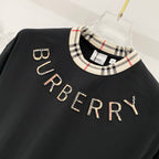 Burberry black short-sleeve T-shirt with checkered collar and large BURBERRY lettering