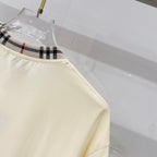 Burberry short-sleeve T-shirt hem with stitched side seam and plaid-trim neckline