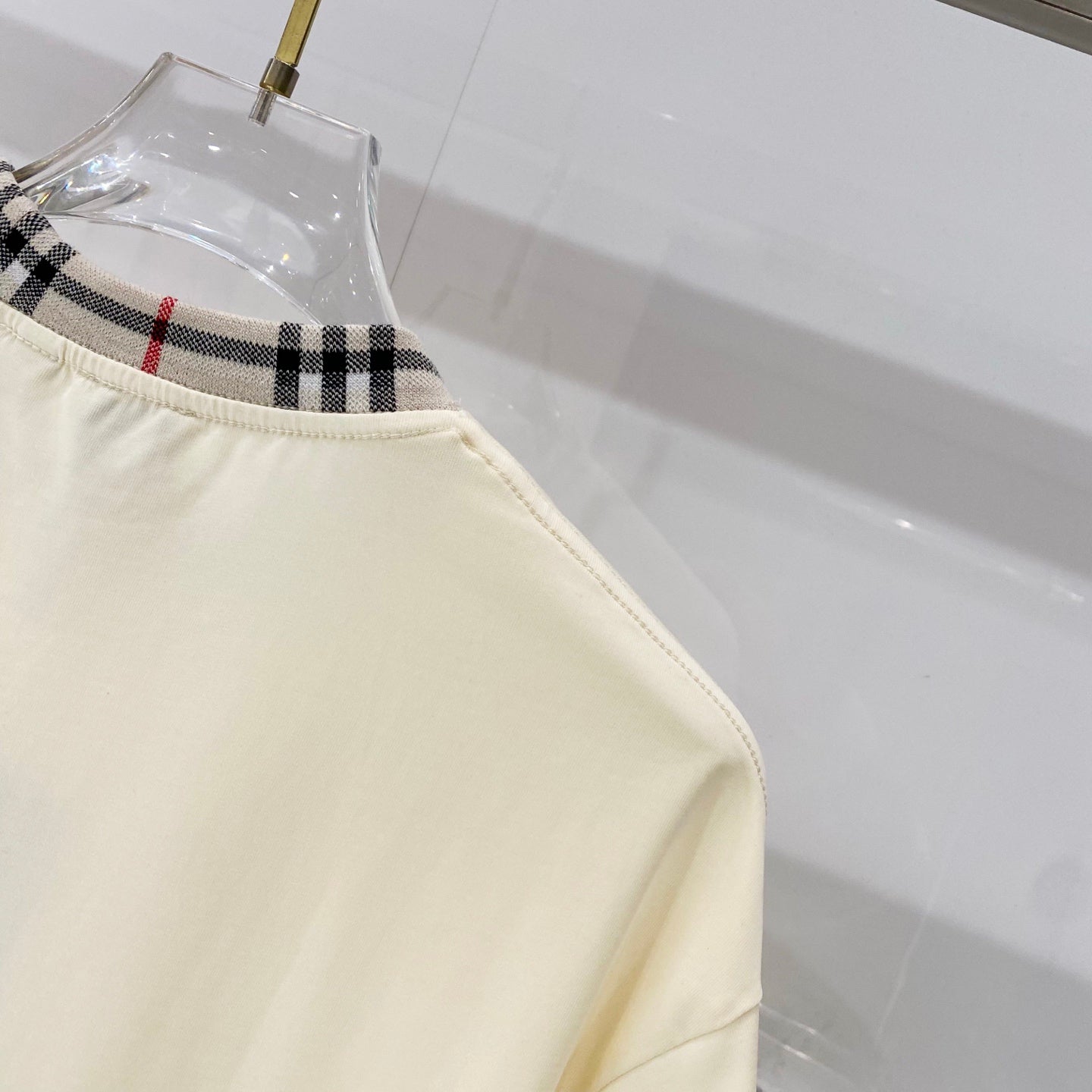 Burberry short-sleeve T-shirt hem with stitched side seam and plaid-trim neckline