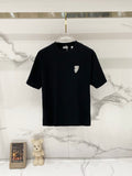 Black short-sleeve T-shirt with small chest crest logo