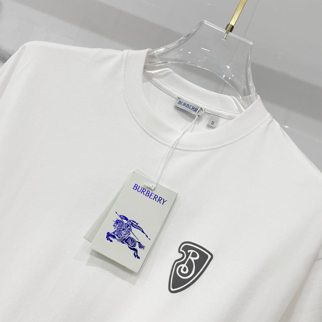 White Burberry T-shirt with crest logo and blue horse graphic, crew neck.