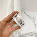 White Burberry T-shirt care label inside neck area.