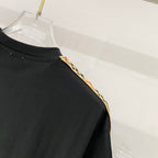 Black Burberry T-shirt neckline and shoulder close-up, crew neck with trim detail.