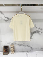 Cream short-sleeve T-shirt on clear hanger