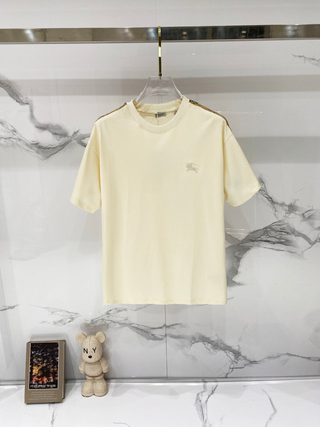 Cream short-sleeve T-shirt with small horse logo on chest