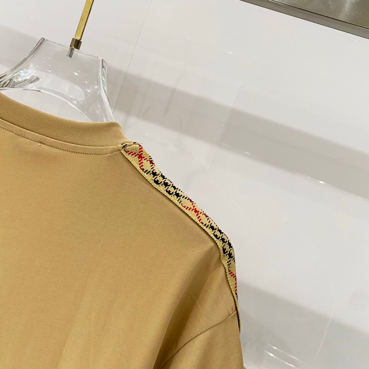 Mustard T-shirt upper back/shoulder with multicolor plaid trim on seam