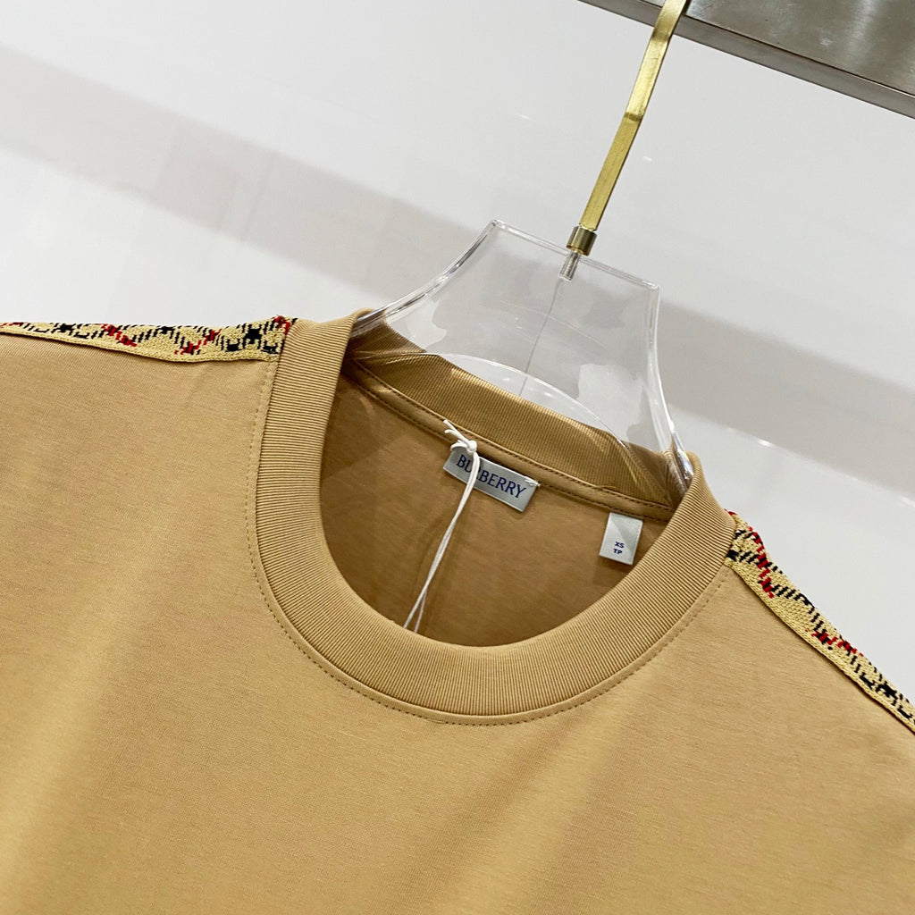 Mustard crewneck T-shirt neckline close-up with inner Burberry hang tag