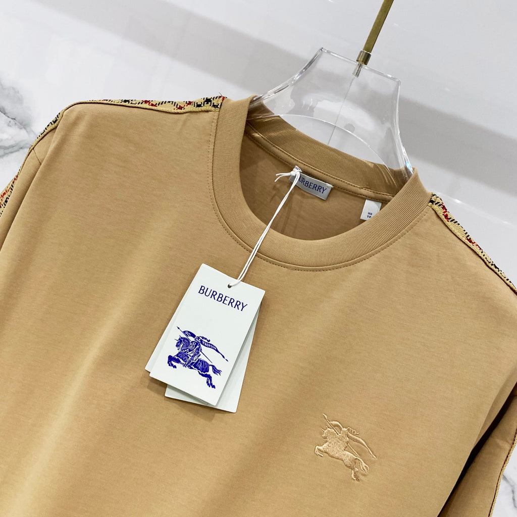 Mustard short-sleeve T-shirt chest close-up with small embroidered horse logo