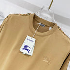 Mustard short-sleeve T-shirt chest close-up with small embroidered horse logo