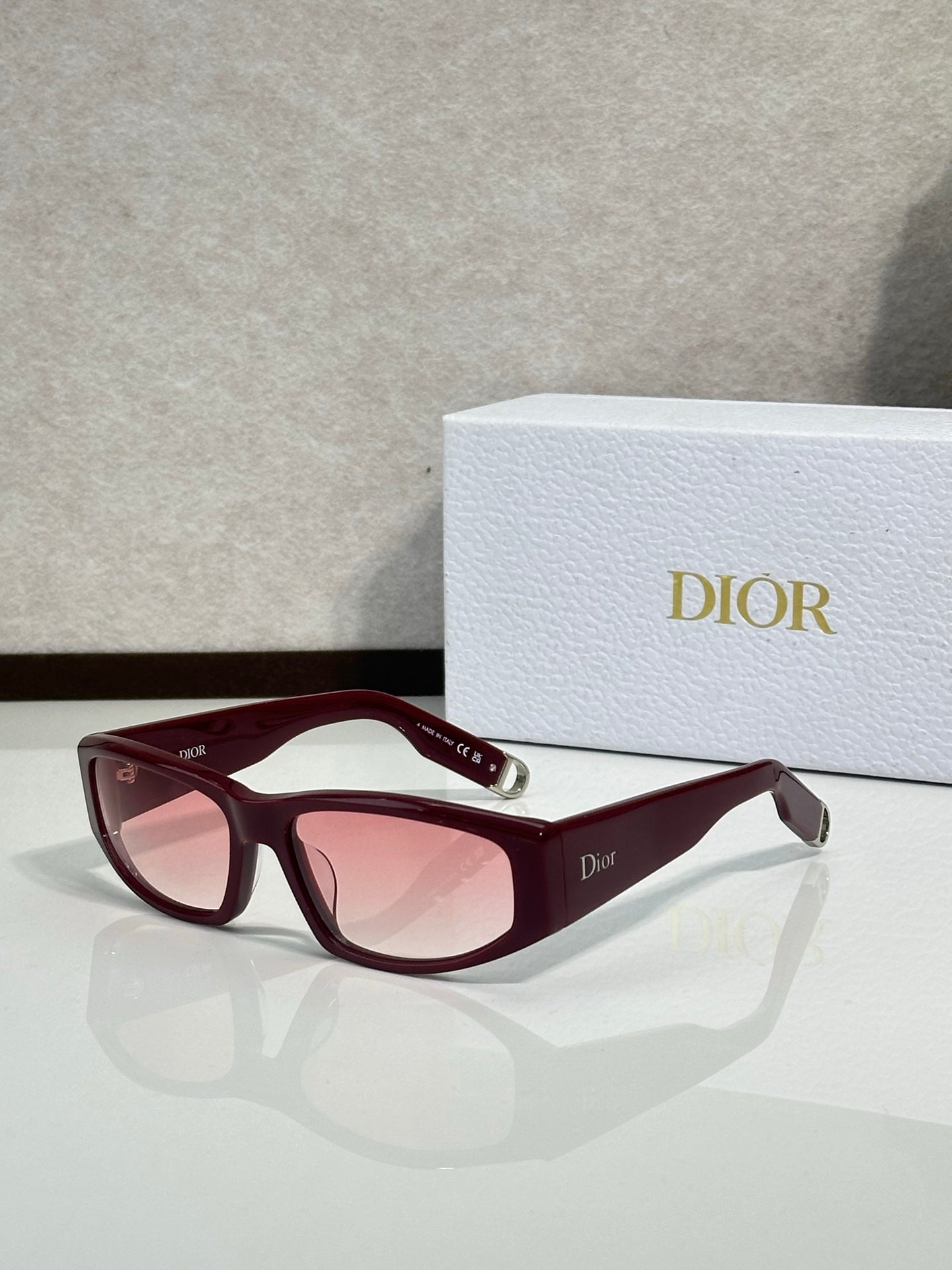 Dior sunglasses with burgundy frame and pink lenses