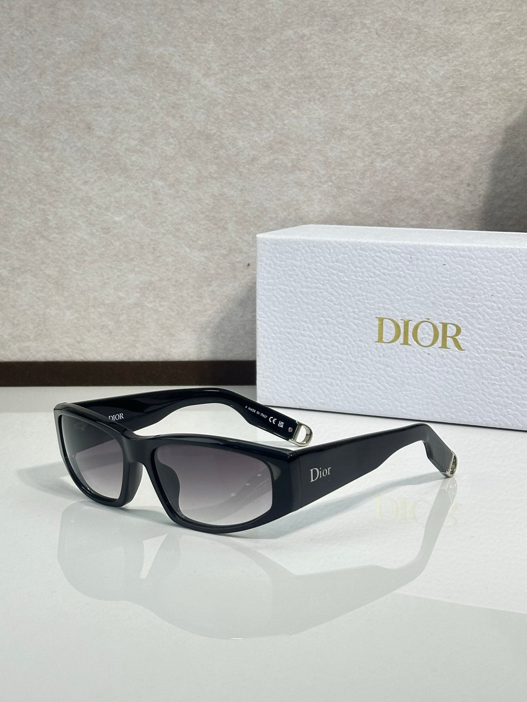 Dior sunglasses with black frame and dark gray gradient lenses
