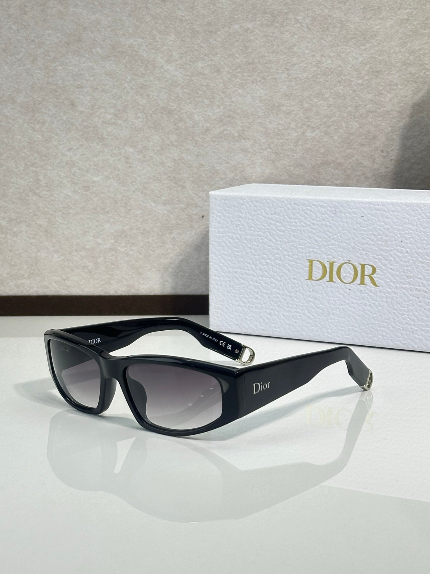 Dior sunglasses with black frame and dark gray gradient lenses