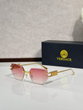 Versace eyeglasses with pink tinted lenses and gold-tone metal frame, rectangular shape