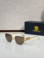 Versace eyeglasses with brown tinted lenses and gold-tone metal frame, rectangular shape