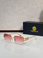 Versace sunglasses with gold metal frame and pink tinted lenses