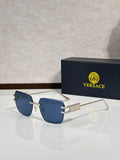 Versace sunglasses with gold metal frame and blue tinted lenses
