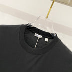 Black crew-neck T-shirt collar with inner label at neckline