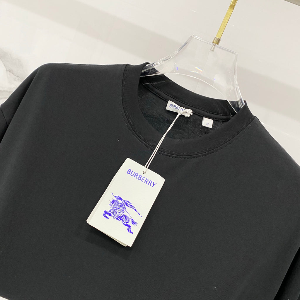 Black crew-neck T-shirt with Burberry neck label and hanging tag
