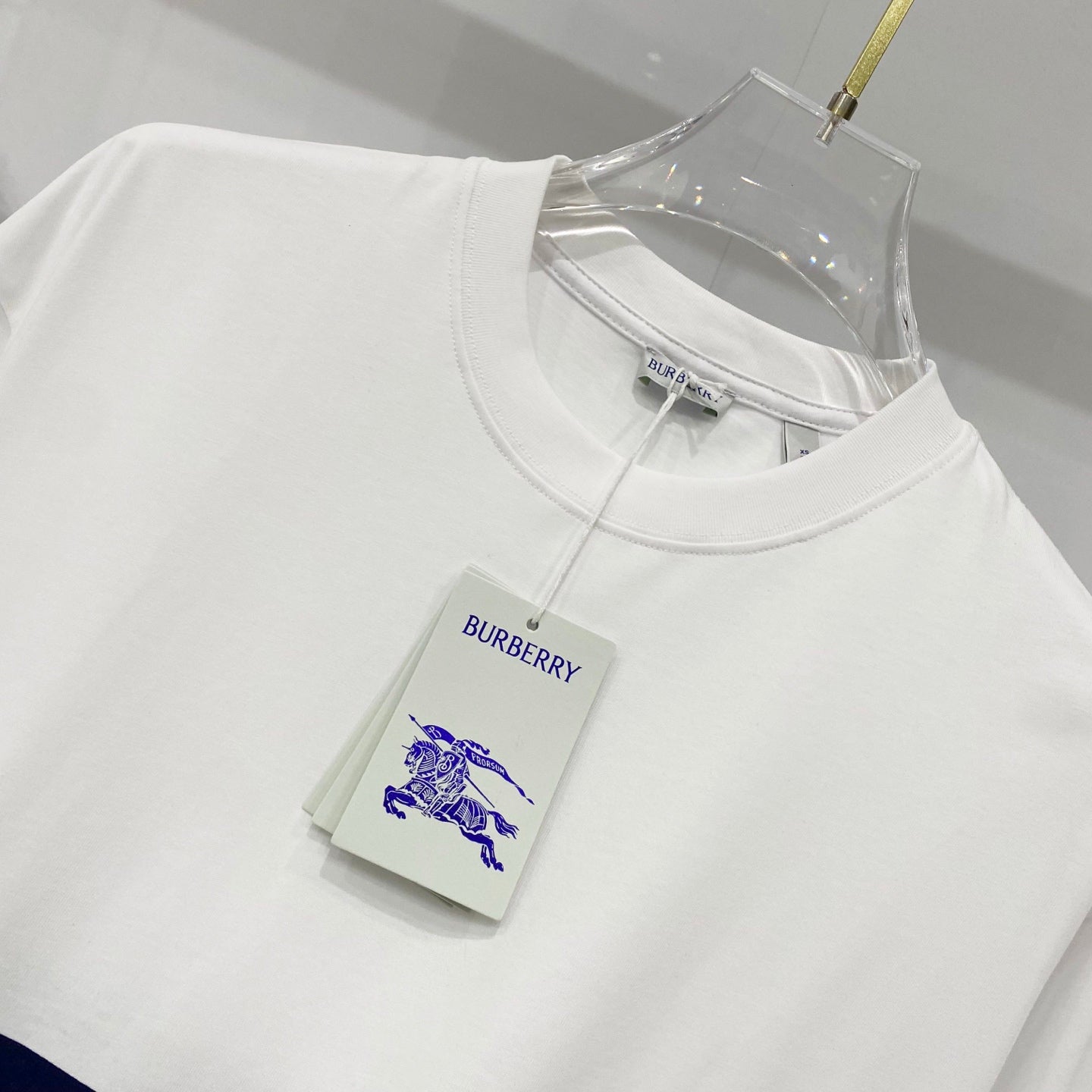 White Burberry T-shirt neckline with size label and logo tag