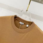 Tan Burberry crewneck T-shirt neckline with brand label inside collar