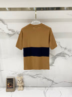 Tan crewneck short-sleeve T-shirt with navy stripe across the chest