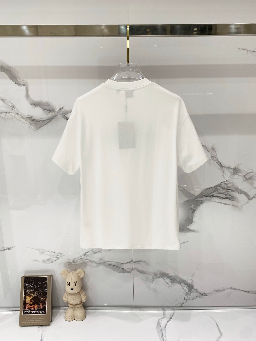 White Burberry short-sleeve T-shirt on hanger, back view