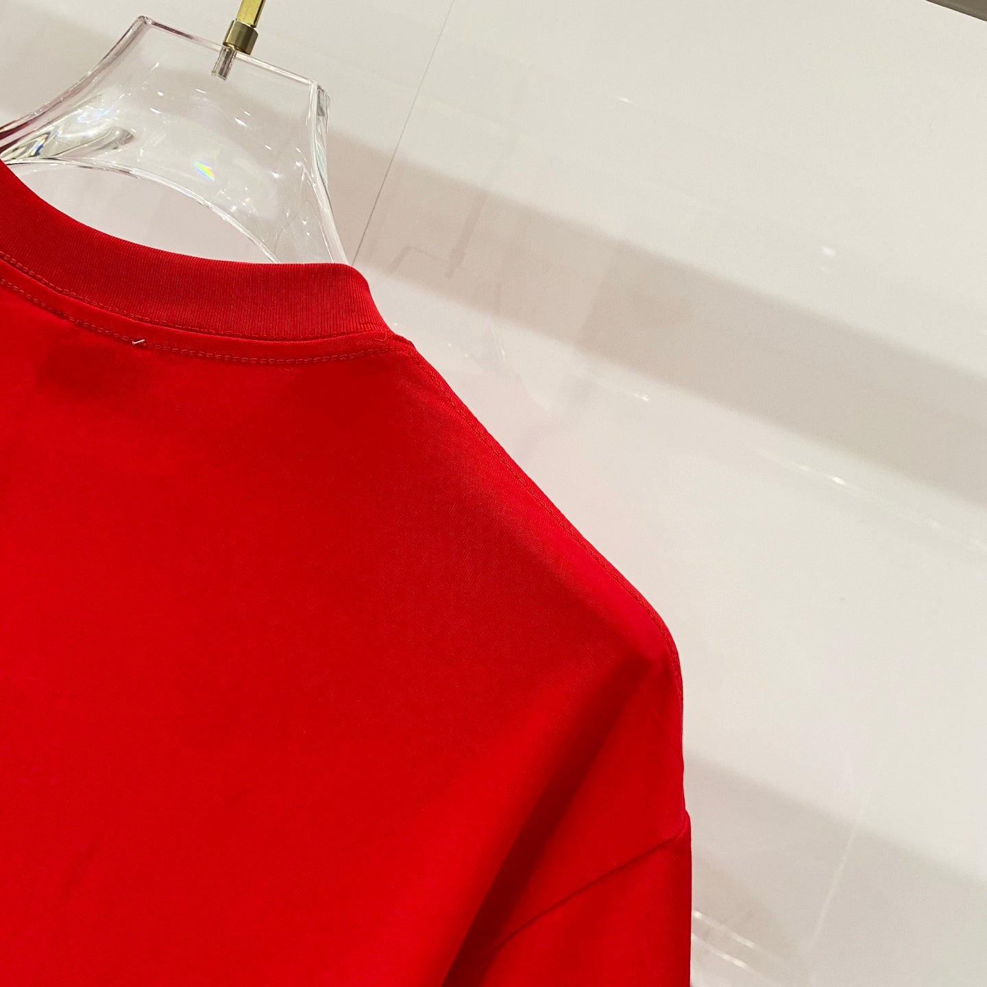 Red Burberry T-shirt shoulder and crew neckline view
