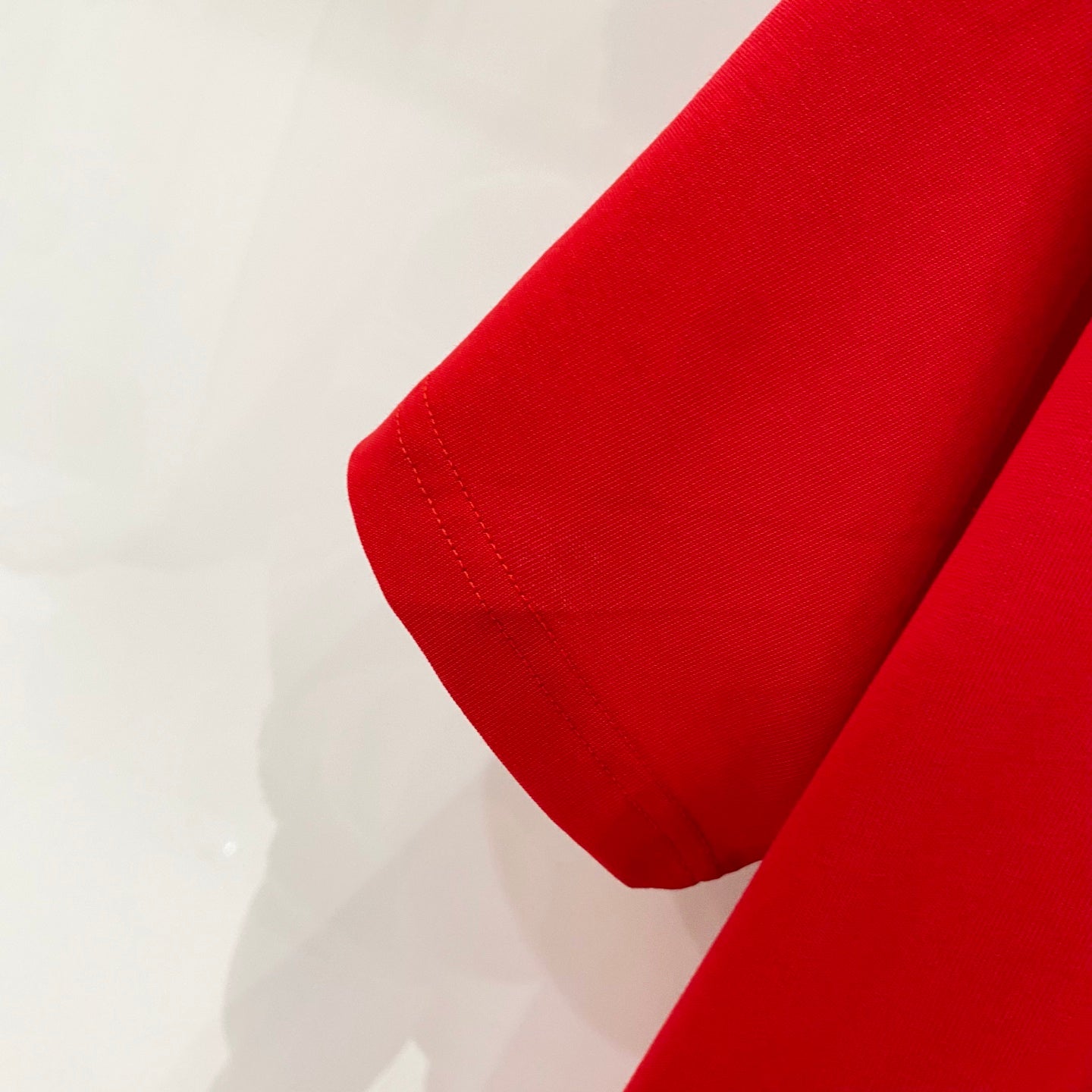 Red Burberry T-shirt short sleeve hem close-up
