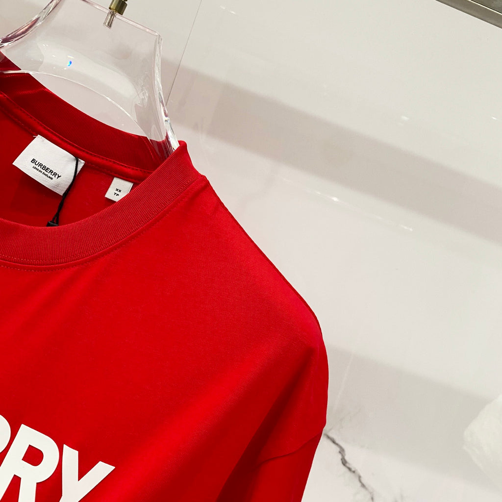 Red Burberry T-shirt upper side seam with size and care tags