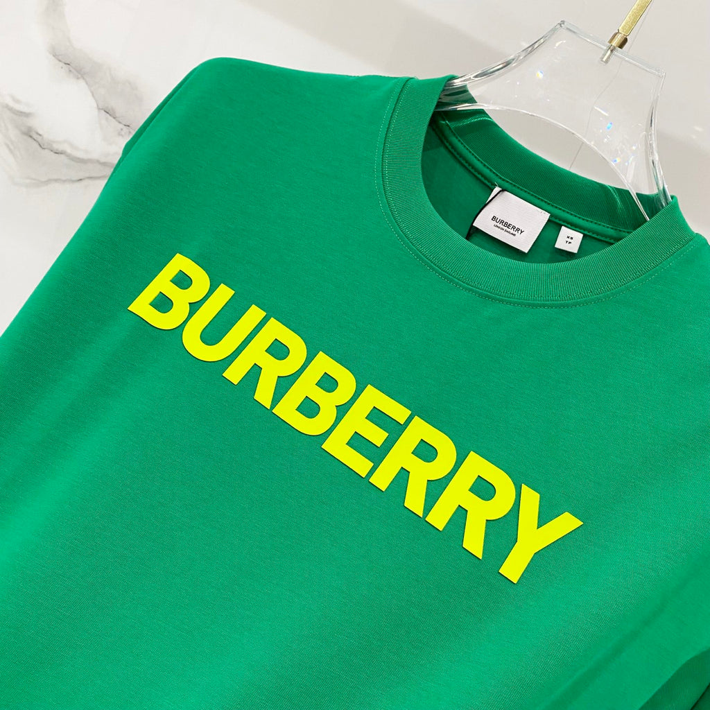 Green T-shirt with large yellow 'BURBERRY' logo across chest