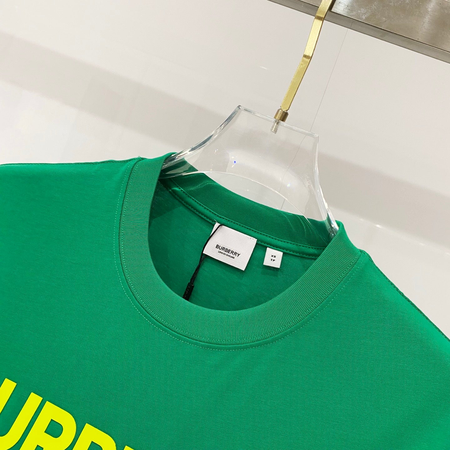 Green T-shirt crew neck with 'BURBERRY' label at collar