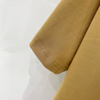 Burberry tan T-shirt sleeve hem close-up with stitched edge