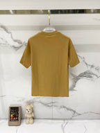 Burberry tan T-shirt on a hanger, back view with crew neck and short sleeves