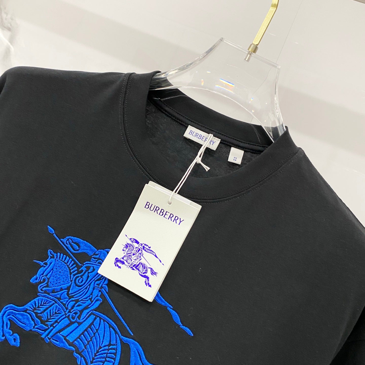 Burberry black crew-neck T-shirt with blue horse embroidery and hang tag