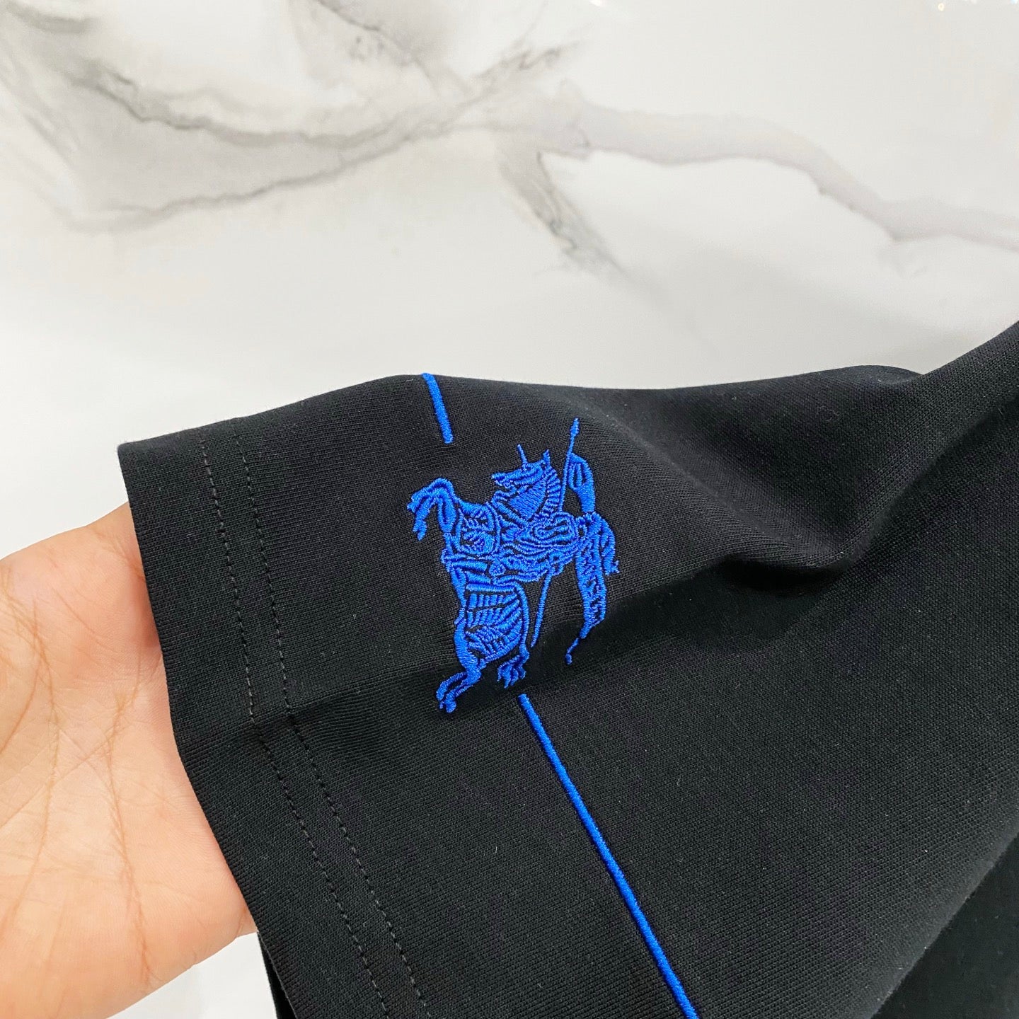 Burberry black short-sleeve T-shirt with blue horse logo on sleeve