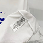 White T-shirt care label and size tag on interior neckline area.