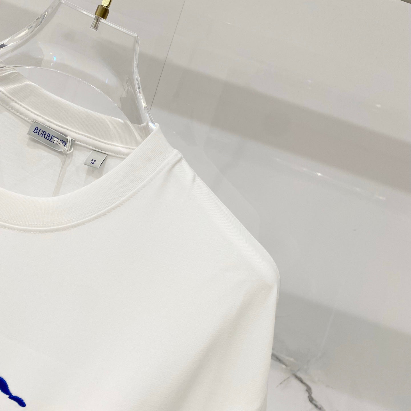 White crew-neck T-shirt with brand label at collar, close-up on hanger.