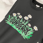 Black Burberry short-sleeve T-shirt with green field and white daisies