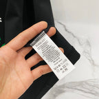 Black Burberry T-shirt care label on tag