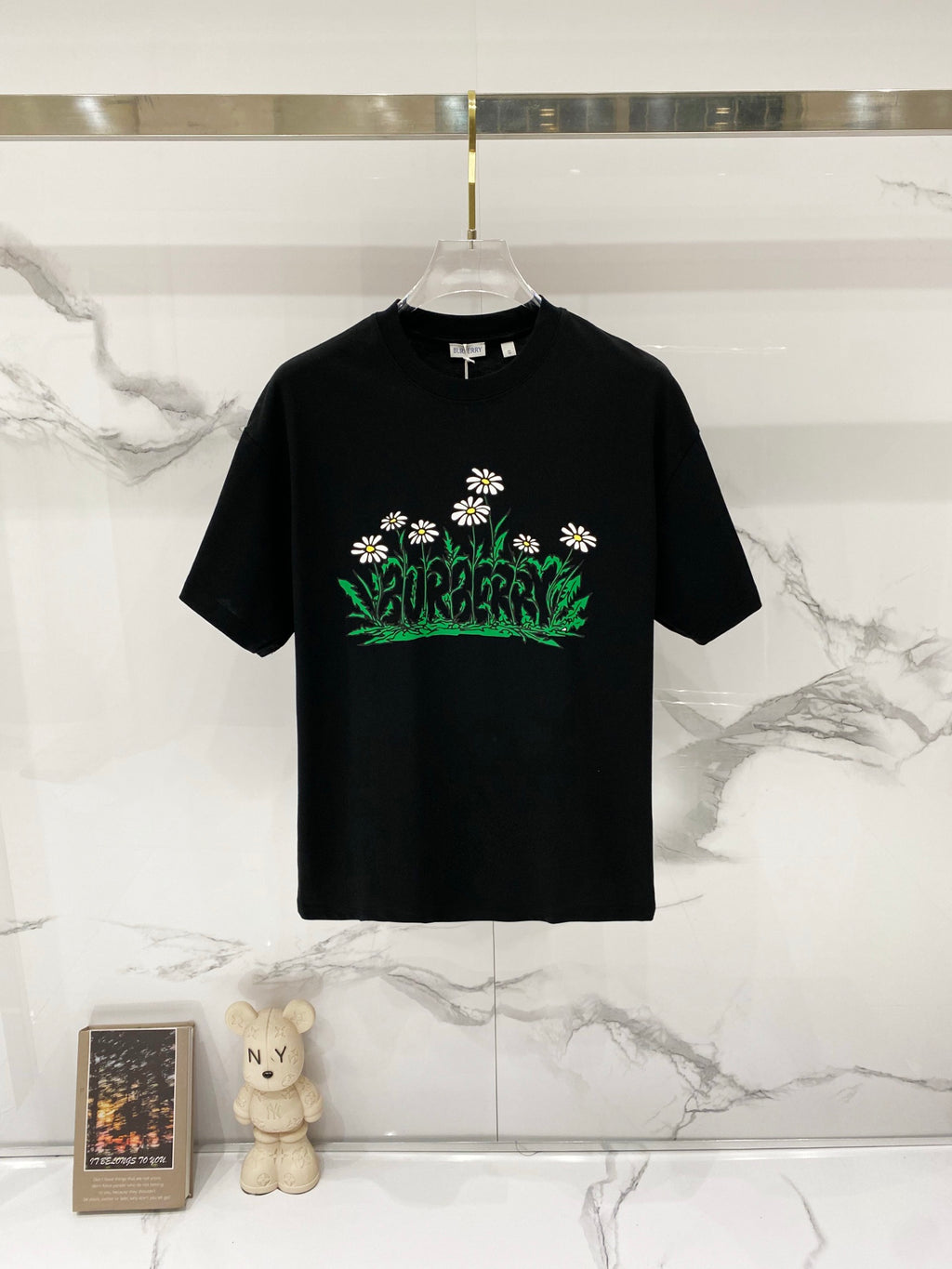 Black Burberry short-sleeve T-shirt with green floral graphic