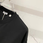 Black Burberry T-shirt collar label at crew neck