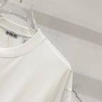 White short-sleeve T-shirt with round crew neck and small inner label