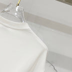 White short-sleeve T-shirt crew neck and shoulder seam, close-up