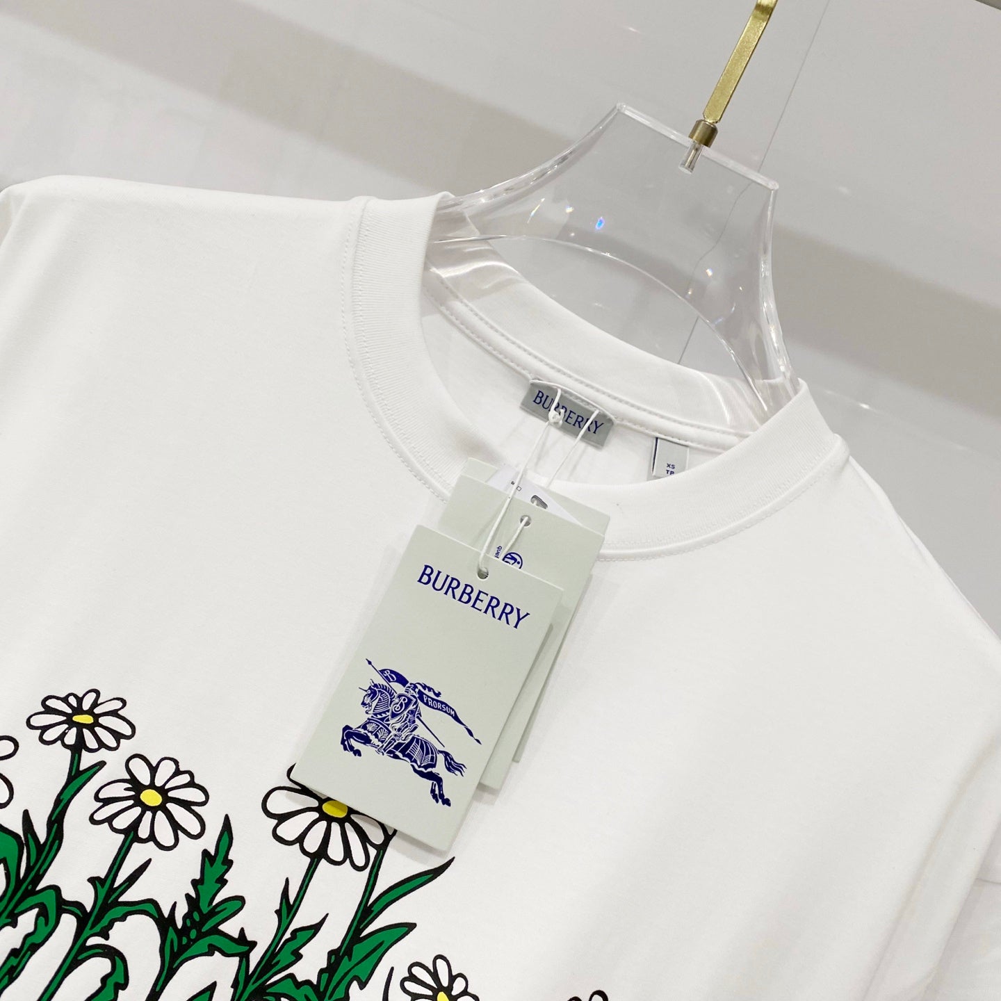 White short-sleeve T-shirt with Burberry bird and flower graphic and swing tag