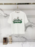 White short-sleeve T-shirt with Burberry graphic flowers and green foliage