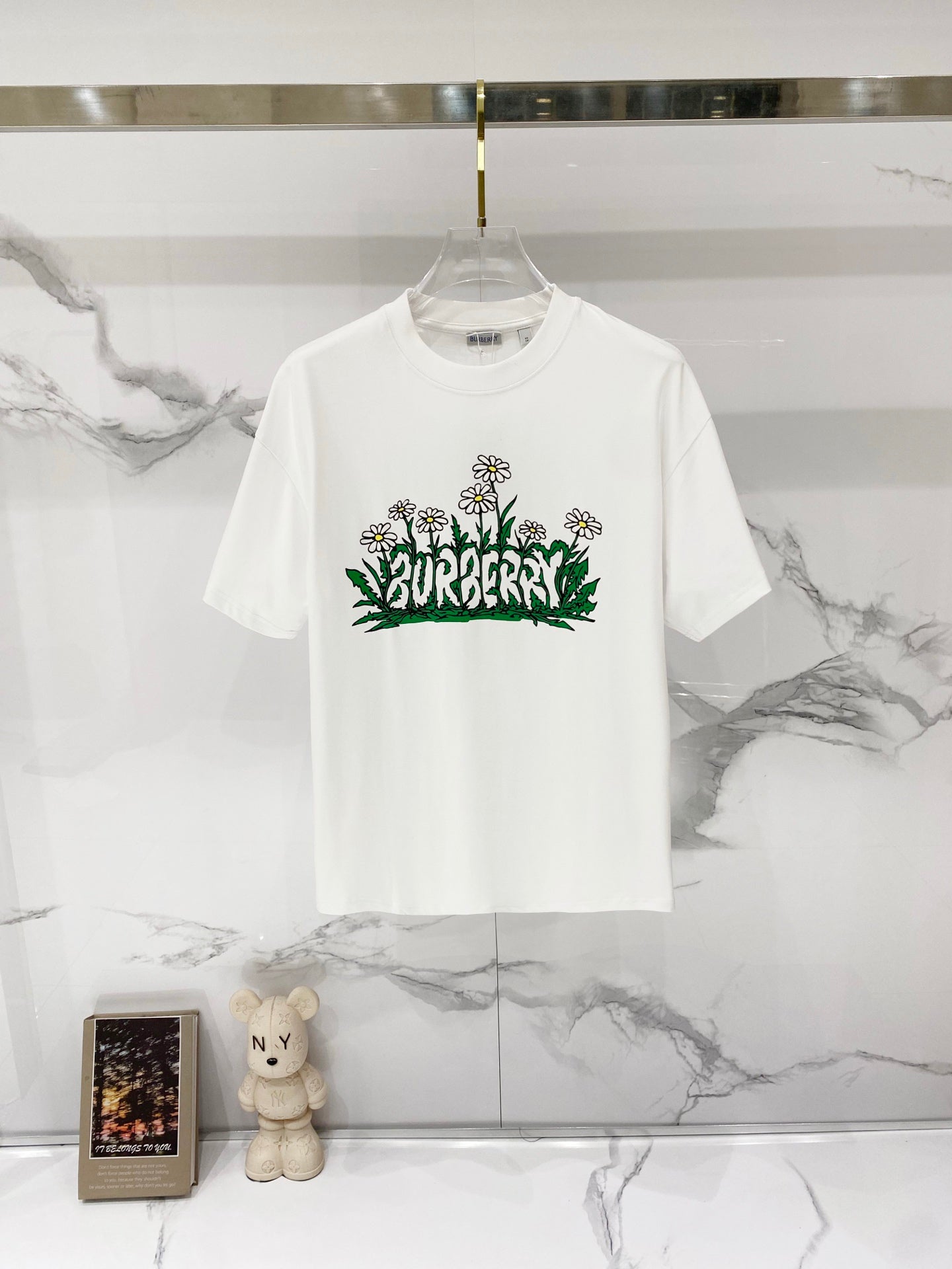 White short-sleeve T-shirt with Burberry graphic flowers and green foliage